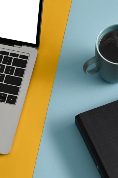 computer-laptop-coffee-cup-and-notebooks-on-color